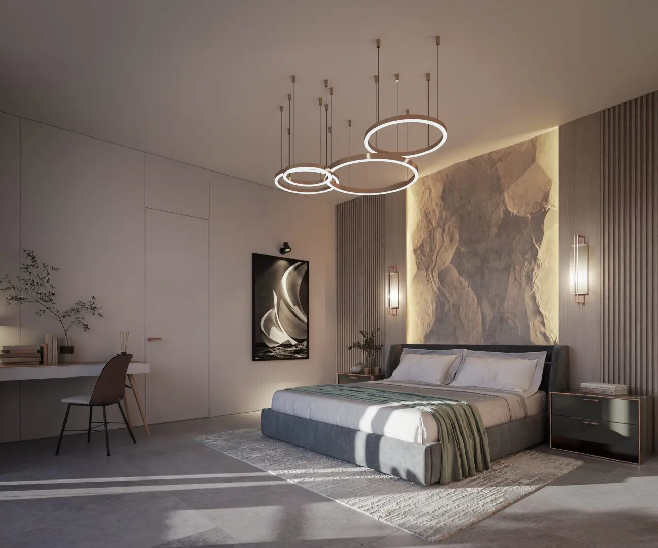 A bedroom with a bed and two lights hanging above it.