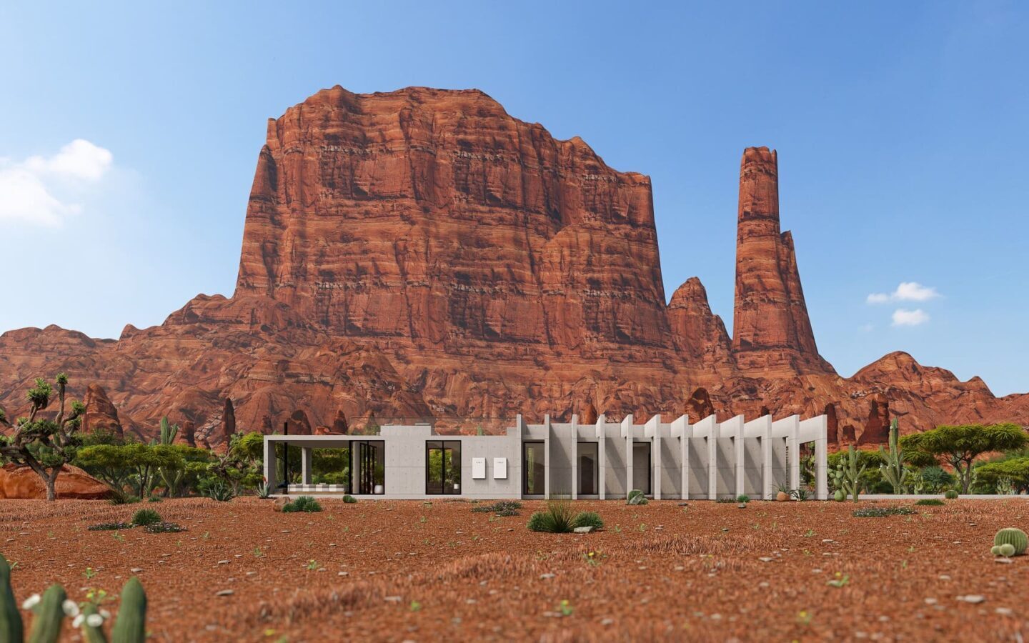 A large rock formation in the background of an open field.