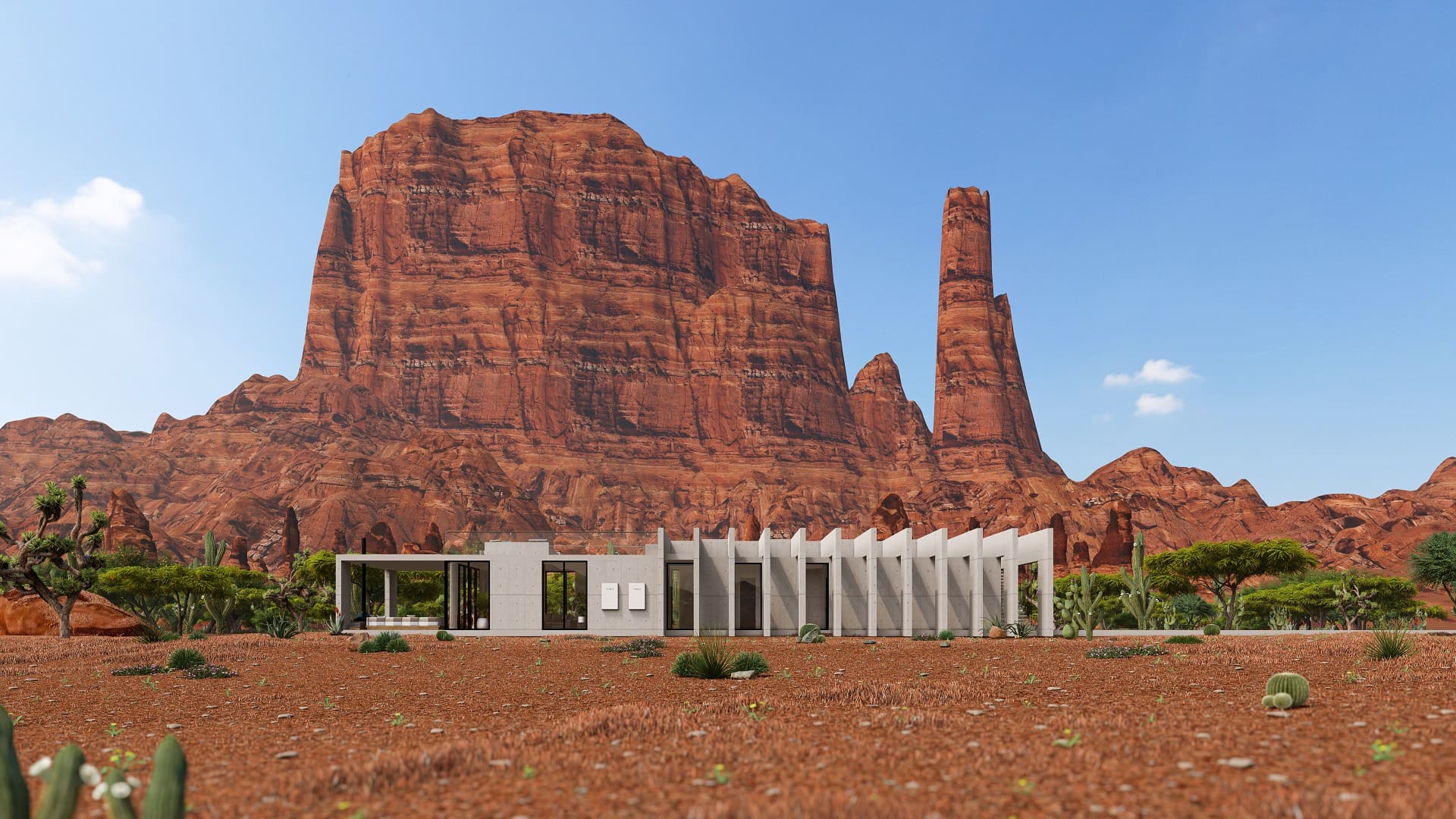 A large rock formation in the background of an open field.